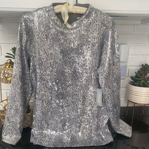 Silver sequin top. With tags. Size 1 Chicos. Back zip.